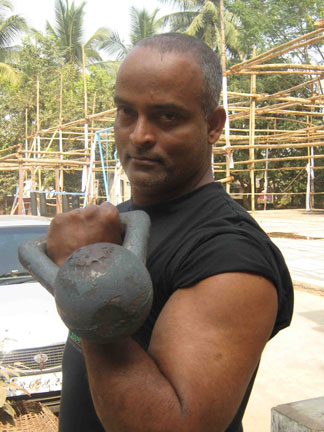 Eminent karate and powersports coach Hari Prasad Pattanayak demonstrates the use of kettlbell in Bhubaneswar on Jan 15, 2009.