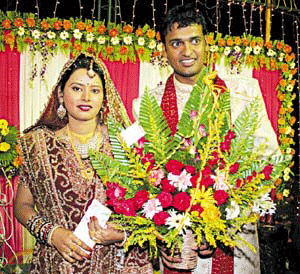 Orissa`s first Test and ODI cricketer Debasis Mohanty with his wife Ritimukta at the reception party of their marriage at Nicco Park in Bhubaneswar on April 30.