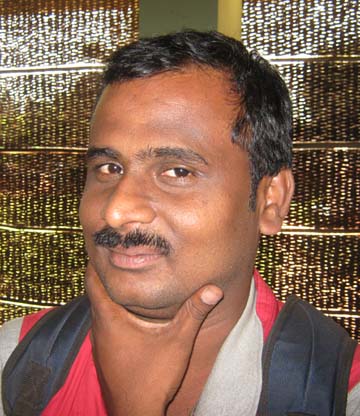 Orissa`s part-time sports photographer <b>Bhabani Prasad Das </b>in Bhubaneswar on March 27, 2009.