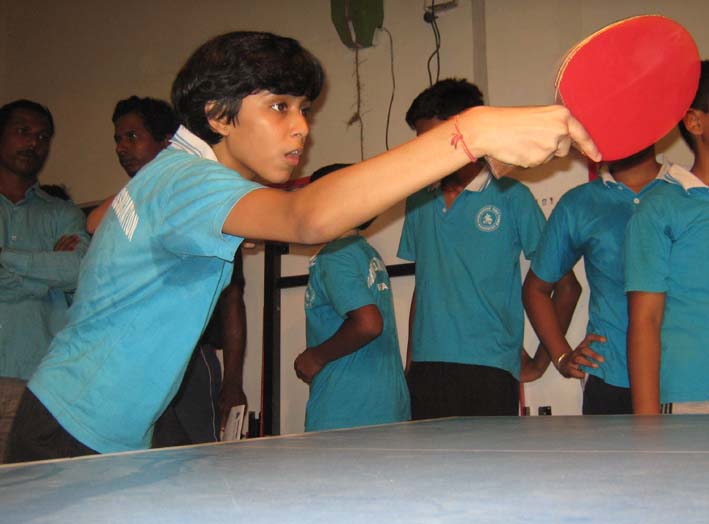 Leading girl paddler <b>Samartha Prusty </b>practices with robo-pong machine at the BTTA summer coaching camp in Bhubaneswar on <b>May 15, 2009.