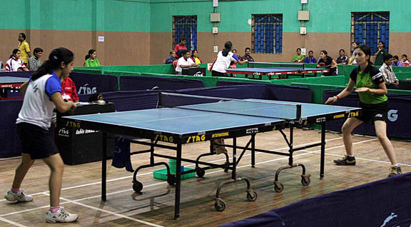 Table Tennis players compete for team title at the National Sports Festival for Women in Bhubaneswar on Jan 19, 2009.