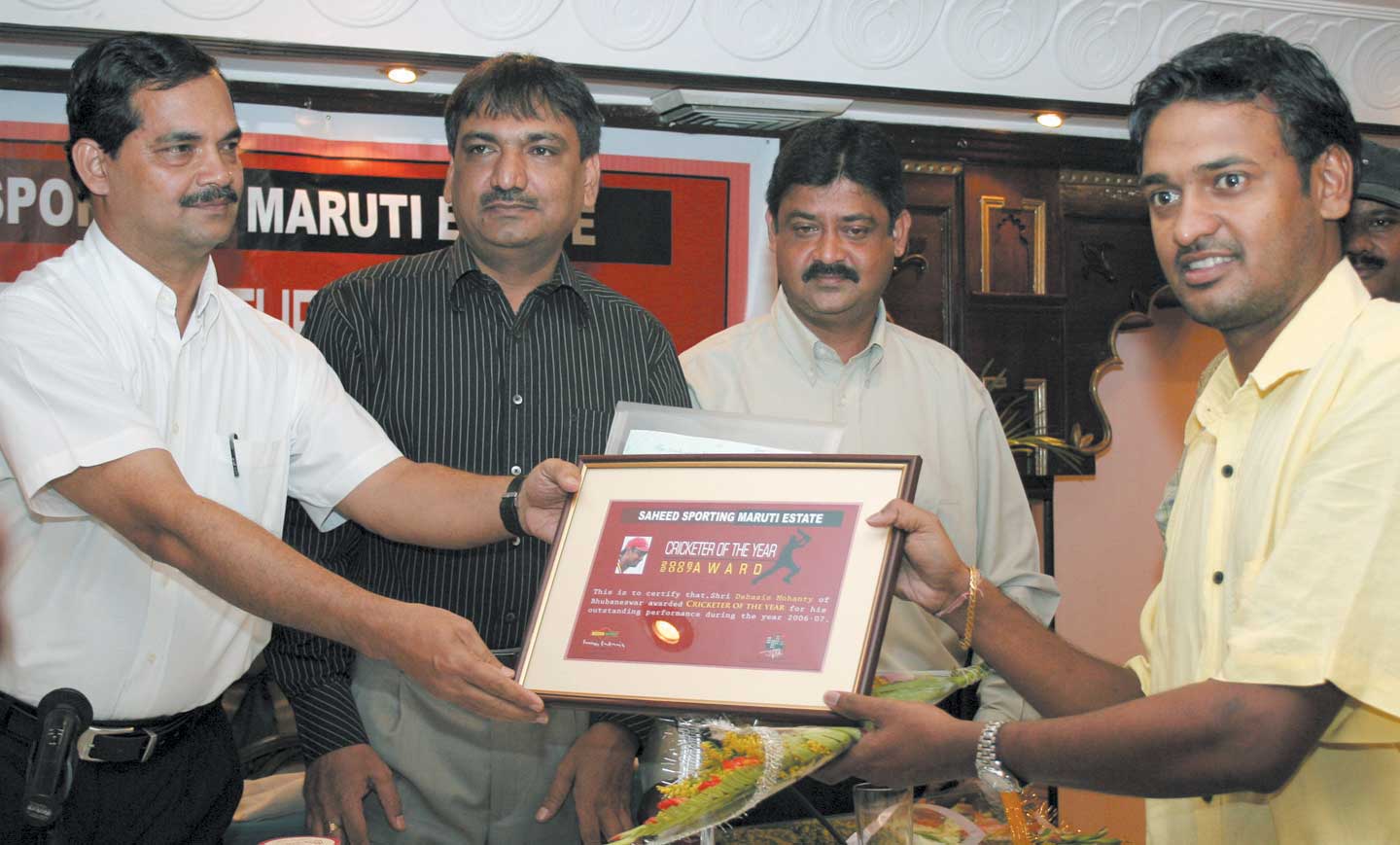 World Cupper Debasis Mohanty (Right) receives the Maruti Estate Saheed Sporting Cricketer of the Year Award in Bhubaneswar on April 16, 2008.