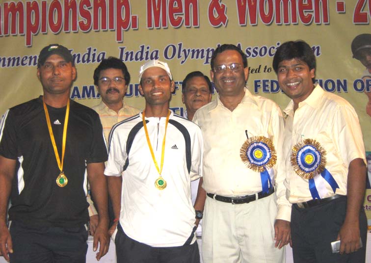 Men`s double champions Lalit Dash and Ajay Nishank receive their medals at the 7th Senior National Soft Tennis Championship in Bhubaneswar on <b>Nov 19, 2009.